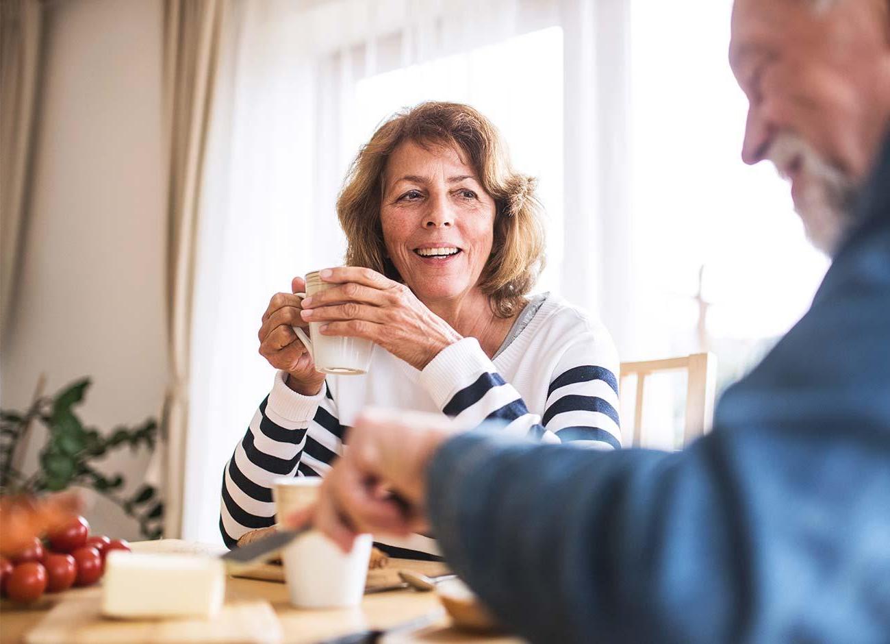 older couple enjoys coffee at home